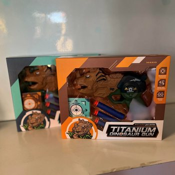 Pistol Dinozaur cu Săgeți și Țintă - Cutie Cadou (Set de 2)